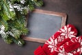 Christmas fir tree, mittens and chalkboard for your greetings Royalty Free Stock Photo