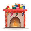 Christmas fireplace with gifts, socks and candles. Royalty Free Stock Photo