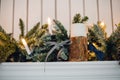 Christmas fireplace, xmas lights decoration, tree branches, candles and pine pieces Royalty Free Stock Photo