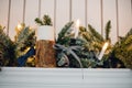 Christmas Fireplace, Xmas Lights Decoration, Tree Branches, candles and pine pieces Royalty Free Stock Photo