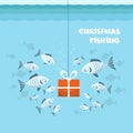 Christmas fishing card. Flock of fish and present gift in sea blue water background. Vector Winter holiday illustration Christmas Royalty Free Stock Photo