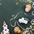 Christmas flat lay on a green stylish background with burning lights Royalty Free Stock Photo