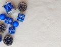Christmas flat lay with a place for text: blue gift boxes, drum, balls, pine cones on a background of the trendy color Royalty Free Stock Photo