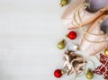 Christmas flat lay Pointe Shoes, tree, balls, star on white wooden background Royalty Free Stock Photo