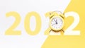 Christmas flat lay 2022. Retro style yellow clock in happy xmas midnight. Countdown to new year on happy xmas yellow Royalty Free Stock Photo