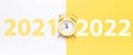 Christmas flat lay 2022. Retro style yellow clock in happy xmas midnight. Countdown to new year on happy xmas yellow Royalty Free Stock Photo
