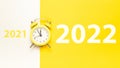 Christmas flat lay 2022. Retro style yellow clock in happy xmas midnight. Countdown to new year on happy xmas yellow Royalty Free Stock Photo