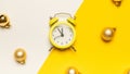 Christmas flat lay 2022. Retro style yellow clock in happy xmas midnight. Countdown to new year on happy xmas yellow Royalty Free Stock Photo