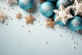 Christmas flat play festive decor of balloons and snowflakes on a light blue background with copy space Royalty Free Stock Photo