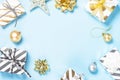 Christmas flatlay background - silver and gold decorations on bl