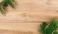 Christmas flatlay on a rustic wooden background: green pine needles with cones. Royalty Free Stock Photo