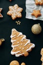 Christmas flatley layout with cookies and a christmas tree. Composition with ginger cookies and cones on a dark background Royalty Free Stock Photo