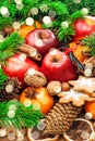 Christmas food background. Apples, cookies, spices, lights Royalty Free Stock Photo