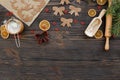 Christmas food background for baking gingerbread cookies with cutters, rolling pin, dough, flour and spices ondark wood table. Royalty Free Stock Photo