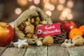 Advent and Christmas food decoration with tag and german text, Frohe Weihnachten, means Merry Christmas Royalty Free Stock Photo