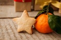 Christmas food. Gingerbread star cookie and tangerine in Christmas setting. Xmas dessert. Christmas vintage wooden Table Royalty Free Stock Photo