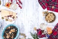 Christmas food in Italy for the holiday. Pasta is black with seafood and various snacks, wine and parmesan cheese. Top view and