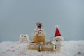 Christmas food photography using marshmallows shaped as snowman and standing in snow with cream sponge fairy cake Royalty Free Stock Photo