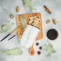 Christmas food with stollen cake on a wooden board and coffee cup on gray table. Flat lay Royalty Free Stock Photo