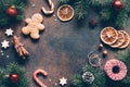Christmas frame or background with gingerbread cookies, spices, fir tree Royalty Free Stock Photo