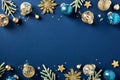 Christmas frame of blue and gold luxury Xmas balls ornaments, fir branches, confetti on dark blue background. Happy New Year Royalty Free Stock Photo