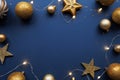 Christmas frame border with golden balls, stars, ribbon on blue background Royalty Free Stock Photo