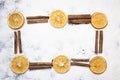 Christmas frame composition made of cinnamon sticks, oranges, cones on white background. Top view, flat lay Royalty Free Stock Photo