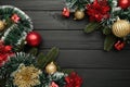 Christmas frame with Christmas decorations on black wooden background Royalty Free Stock Photo
