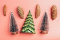 Christmas frame with fir branches, conifer cones, silver ornaments on pastel background Royalty Free Stock Photo