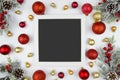 Christmas frame with fir branches decorated with red balls. Flatly trandy mockup. Top view Royalty Free Stock Photo