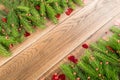 Christmas frame with fir branches on wooden background Royalty Free Stock Photo