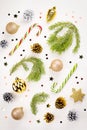 Christmas frame flat lay with pine, presents, golden elements, candy canes, confetti. Christmas template on white wood Royalty Free Stock Photo