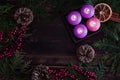Christmas frame from four purple burning advent candles Royalty Free Stock Photo