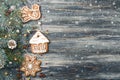Christmas Frame of Gingerbread cookies on spruce over snowy wooden background copy space Royalty Free Stock Photo