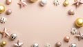 Christmas frame made of elegant Xmas decorations, golden and silver balls, pink stars on pastel ivory background. Glamour greeting Royalty Free Stock Photo