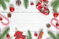 Christmas frame made of fir branches, decorations, berries, candy, christmas food and pine cones. top view. flatlay Royalty Free Stock Photo