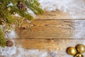 Christmas frame made of fir branches, festive decorations and pine cones on wooden table. Christmas background. Royalty Free Stock Photo