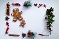 Christmas frame made with natural mistletoe, cinnamon, anise and gingerbread man Royalty Free Stock Photo