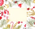 Christmas frame made of Xmas decorations and vintage paper card. Golden gift, star, red holly berries and green fir branch Royalty Free Stock Photo