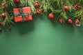 Christmas frame with red gift box, pine branches, and red balls. Xmas greeting card. Happy New Year.