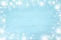 Christmas frame of snowflake with copy space, on blue board wooden background