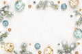 Christmas frame on snowy white background with gold blue decorations, copy space Royalty Free Stock Photo