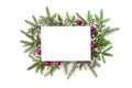 Christmas frame from a Christmas tree garland with decorations in pink tones. Christmas background with sheet of white paper and Royalty Free Stock Photo