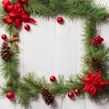 Christmas wreath border frame on a white wooden background. Royalty Free Stock Photo