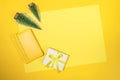 Christmas frame of yellow notepad - organizer on 2021, small Xmas trees, DIY gift box on yellow sheet with copy space