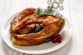 Christmas fried carp fish slices on a ceramic plate on the white table, close up. Traditional christmas eve dish. Royalty Free Stock Photo