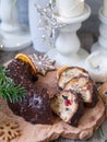 Christmas fruit cake, pudding on wooden plate with ginger cookies and chokolate-nut glaze. Copy space. Close up Royalty Free Stock Photo