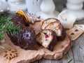Christmas fruit cake, pudding on wooden plate with ginger cookies and chokolate-nut glaze. Copy space. Close up Royalty Free Stock Photo