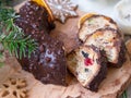 Christmas fruit cake, pudding on wooden plate with ginger cookies and chokolate-nut glaze. Copy space. Close up Royalty Free Stock Photo