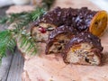 Christmas fruit cake, pudding on wooden plate with ginger cookies and chokolate-nut glaze. Copy space. Close up Royalty Free Stock Photo